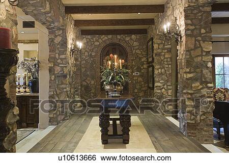 Stock Photograph - Exposed stone entrance hallway of Palm Springs home. Fotosearch
