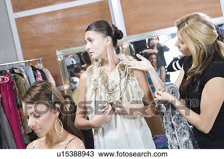 Fashion model and stylist in dressing room View Large Photo Image Stock Image - Fashion model and stylist in dressing room. Fotosearch