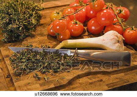 Food on chopping board View Large Photo Image Stock Photograph - Food on chopping board. Fotosearch