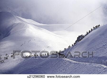 French Alps tourists in distance View Large Photo Image Stock Image - French Alps tourists in distance. Fotosearch
