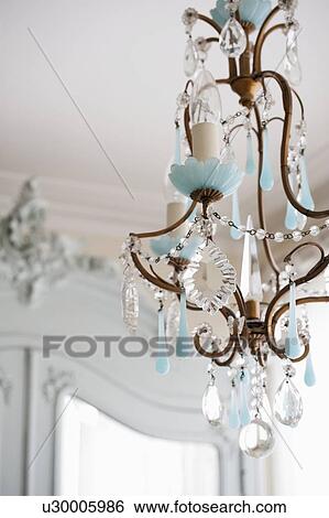 Stock Photograph - Glass and metalworked chandelier. Fotosearch