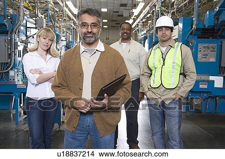 Picture - Group of people working in newspaper factory portrait. Fotosearch