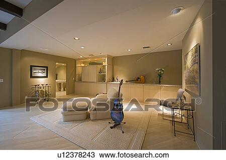 Stock Image - Guitar in interior of home. Fotosearch