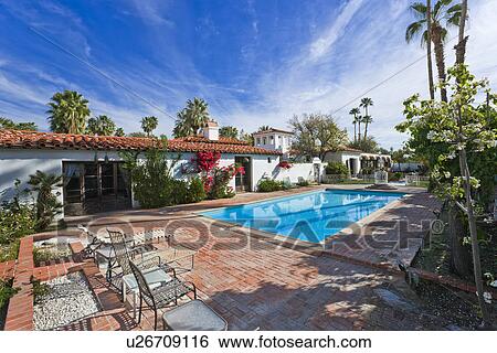Stock Photograph - House exterior with swimming pool. Fotosearch