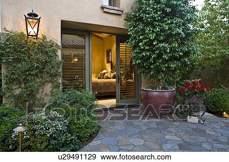 House exterior with view into bedroom View Large Photo Image Stock Photo - House exterior with view into bedroom. Fotosearch