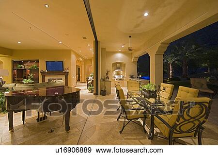 Stock Photo - House interior with dining table and grand piano. Fotosearch