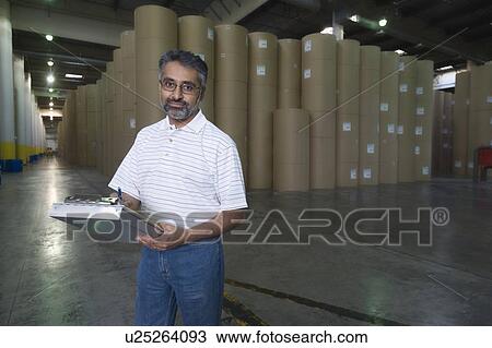 Huge rolls of paper in newspaper factory View Large Photo Image Stock Image - Huge rolls of paper in newspaper factory. Fotosearch