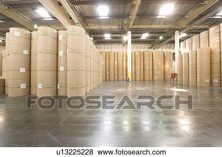 Stock Photo - Huge rolls of paper in newspaper factory. Fotosearch