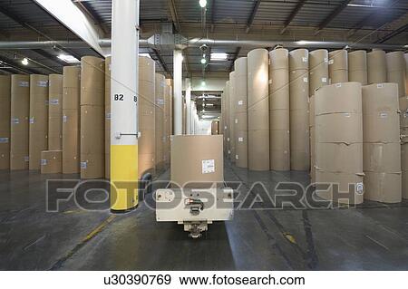 Huge rolls of paper in newspaper factory View Large Photo Image Stock Photo - Huge rolls of paper in newspaper factory. Fotosearch