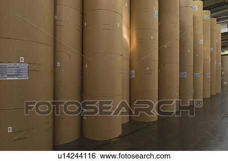 Stock Photograph - Huge rolls of paper in newspaper factory. Fotosearch
