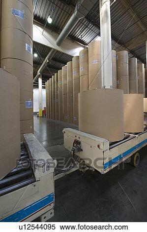 Huge rolls of paper in newspaper factory View Large Photo Image Stock Photography - Huge rolls of paper in newspaper factory. Fotosearch
