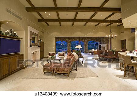 Illuminated interior of luxurious residence View Large Photo Image Stock Photo - Illuminated interior of luxurious residence. Fotosearch