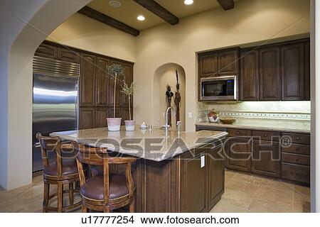 Illuminated kitchen in residence View Large Photo Image Picture - Illuminated kitchen in residence. Fotosearch