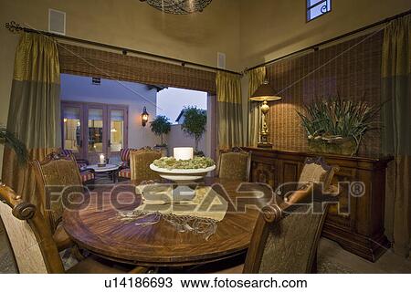 Stock Image - Illuminated luxurious residence interior. Fotosearch