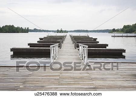 Stock Photo - Jetty in lake absence. Fotosearch