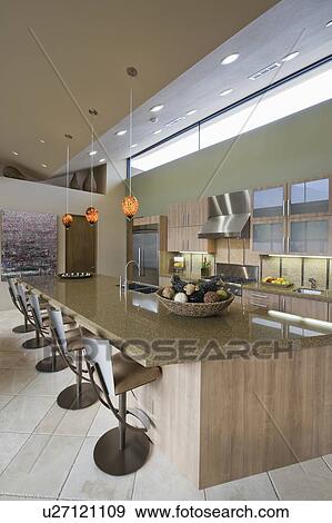 Kitchen worktop and barstoools in Palm Springs home View Large Photo Image Stock Photo - Kitchen worktop and barstoools in Palm Springs home. Fotosearch