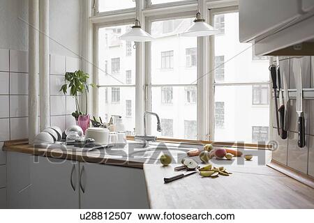 Kitchen worktop with chopped fruit and veg in urban apartment View Large Photo Image Stock Photo - Kitchen worktop with chopped fruit and veg in urban apartment. Fotosearch