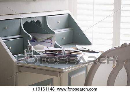 Stock Photo - Letters tied with ribbon on writing desk. Fotosearch