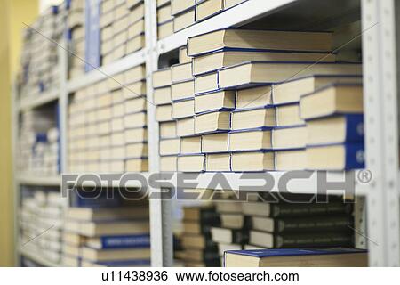 Stock Photograph - Library books on shelves. Fotosearch