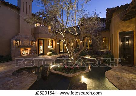Lit Palm Springs courtyard with pool View Large Photo Image Stock Image - Lit Palm Springs courtyard with pool. Fotosearch