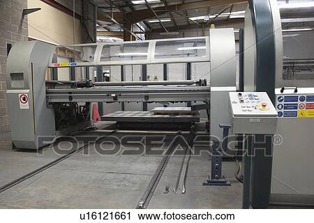Stock Image - Loading platform for a Salvernini CAM sheet metal folding machine. Fotosearch