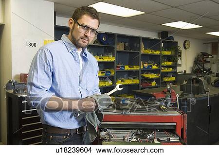 Picture - Man in workshop with tools. Fotosearch