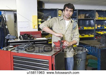 Man in workshop with tools View Large Photo Image Stock Image - Man in workshop with tools. Fotosearch