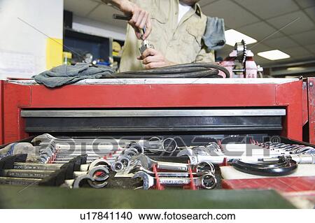 Man in workshop with tools View Large Photo Image Stock Image - Man in workshop with tools. Fotosearch