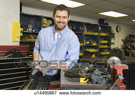 Man in workshop with tools View Large Photo Image Stock Photo - Man in workshop with tools. Fotosearch