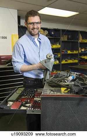 Man in workshop with tools View Large Photo Image Stock Photo - Man in workshop with tools. Fotosearch