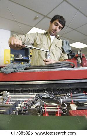 Man in workshop with tools View Large Photo Image Stock Photography - Man in workshop with tools. Fotosearch
