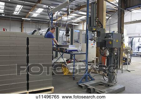 Man spotwelding light fitting bodys View Large Photo Image Stock Photography - Man spotwelding light fitting bodys. Fotosearch