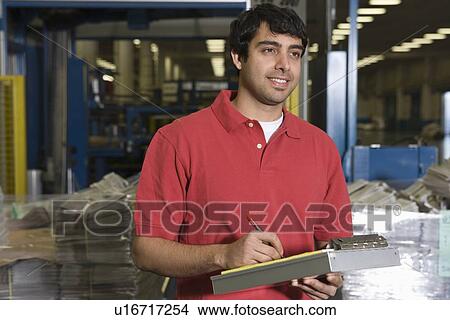 Picture - Man working in newspaper factory. Fotosearch