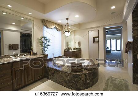 Marble bath with surround in Palm Springs home View Large Photo Image Stock Photo - Marble bath with surround in Palm Springs home. Fotosearch