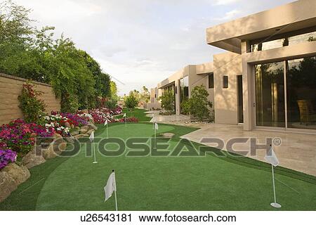 Stock Image - Mini golf course in Palm Springs garden. Fotosearch