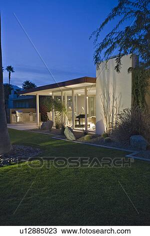 Modern house exterior illuminated at dusk View Large Photo Image Stock Image - Modern house exterior illuminated at dusk. Fotosearch