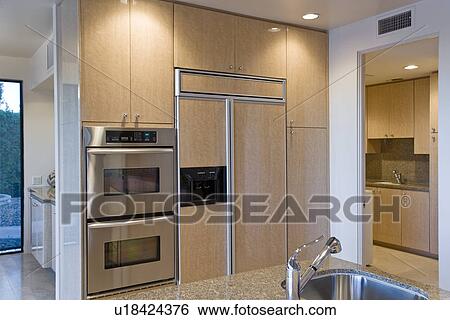 Stock Photograph - Modern kitchen with stainless steel appliance. Fotosearch