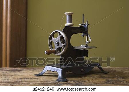 Stock Image - Old fashioned sewing machine. Fotosearch