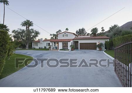 Open gate and driveway of Palm Springs home View Large Photo Image Stock Photo - Open gate and driveway of Palm Springs home. Fotosearch