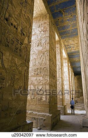 Stock Photo - Painted carvings of hieroglyphs and figures at Medinet Habu (Mortuary Temple of Ramses III) aka The Ramesseum. West Bank Luxor Egypt. Fotosearch