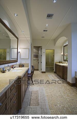 Stock Photography - Palm Springs bathroom with mosaic tiled floor. Fotosearch