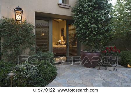 Palm Springs exterior with crazy paving and pot plant View Large Photo Image Stock Image - Palm Springs exterior with crazy paving and pot plant. Fotosearch