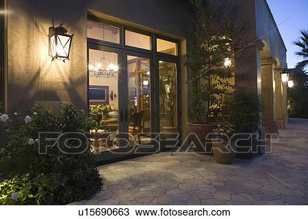 Stock Image - Palm Springs exterior with wall mounted lighting. Fotosearch