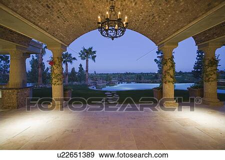 Stock Photo - Palm Springs hacienda at dusk. Fotosearch