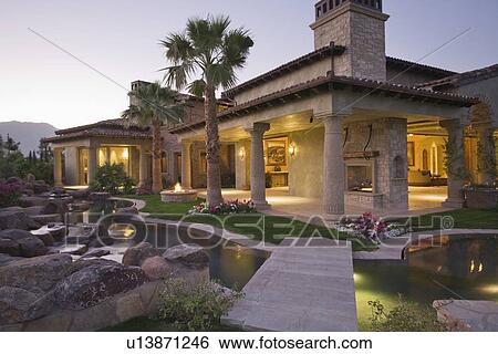 Palm Springs hacienda at dusk View Large Photo Image Stock Photograph - Palm Springs hacienda at dusk. Fotosearch