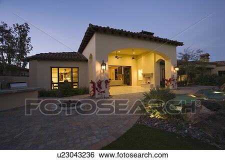 Palm Springs house exterior at twilight View Large Photo Image Stock Photograph - Palm Springs house exterior at twilight. Fotosearch