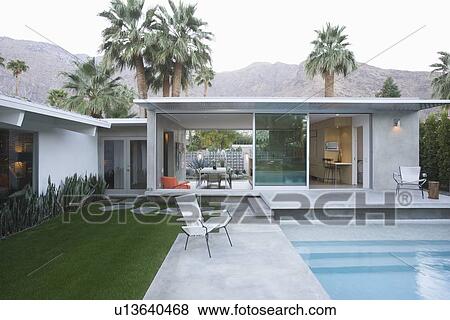 Palm Springs swimming pool and home exterior View Large Photo Image Stock Photo - Palm Springs swimming pool and home exterior. Fotosearch