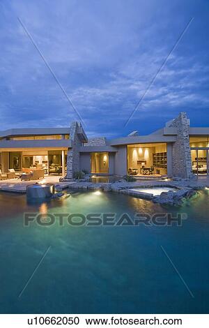 Palm Springs swimming pool and house exterior at dusk View Large Photo Image Stock Image - Palm Springs swimming pool and house exterior at dusk. Fotosearch