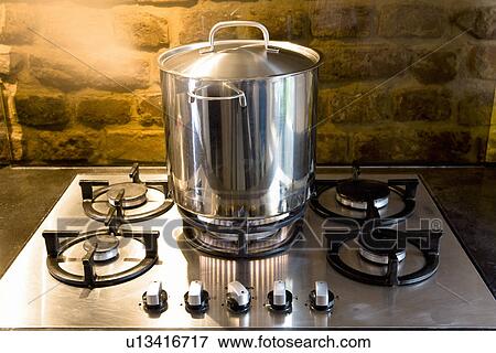 Pan on stove View Large Photo Image Stock Photo - Pan on stove. Fotosearch