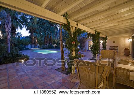 Patio with chairs and table at dusk View Large Photo Image Stock Image - Patio with chairs and table at dusk. Fotosearch